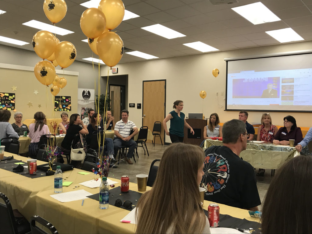 Program Manager sharing clues with staff before the big reveal Click to Enlarge