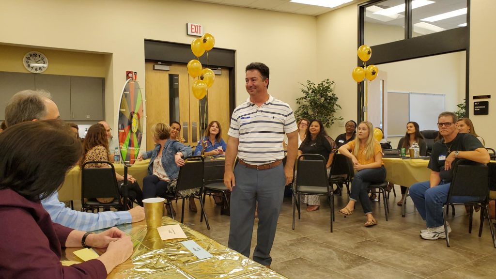 Staff member answering trivia question Click to Enlarge