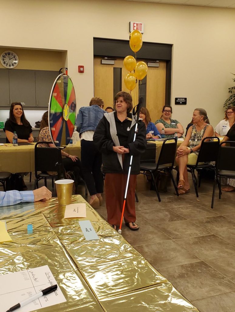 Staff Member at Spinning Wheel Click to Enlarge